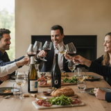 Group of people toasting with wine glasses at a dinner table.