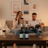 Two bottles of Aphelion wine on a white background